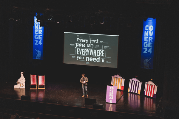Distant shot of Elliot Jay Stocks speaking on stage at Converge Brighton 2024.